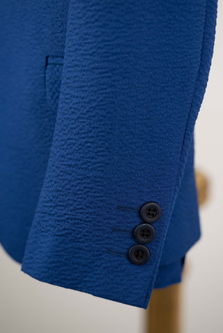 Blue Zenmoni kids' suit with a vest