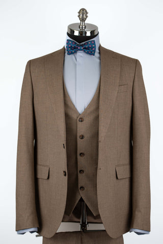 Brown Quesste extended suit with a vest