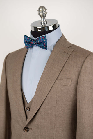 Brown Quesste extended suit with a vest