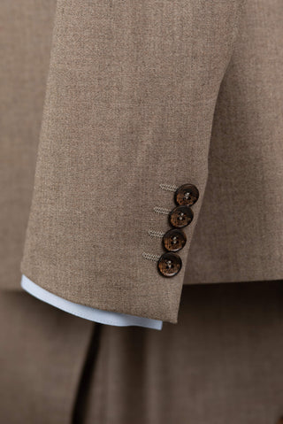 Brown Quesste extended suit with a vest