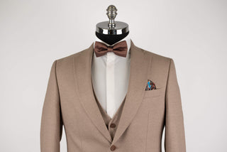Light brown Quesste extended suit with a vest