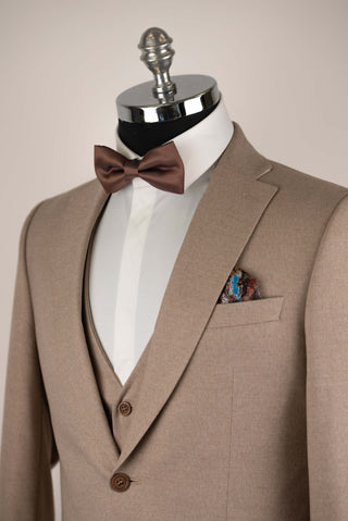 Light brown Quesste extended suit with a vest