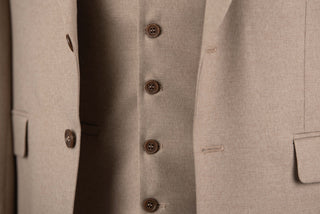 Light brown Quesste extended suit with a vest