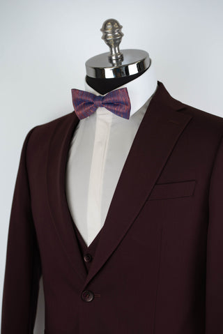Dark burgundy Quesste extended suit with a vest