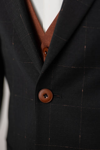 Black Quesste extended suit with plaid pattern and a brown vest