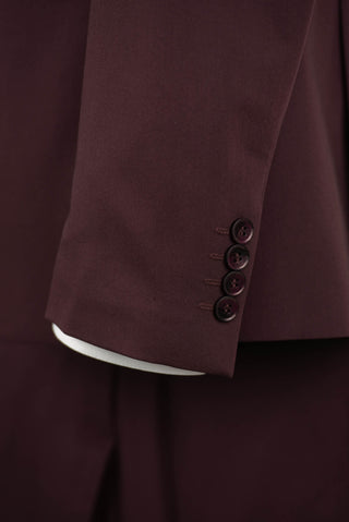 Dark burgundy Quesste extended suit with a vest