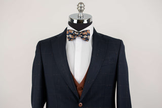 Dark blue Quesste extended suit with plaid pattern and a brown vest