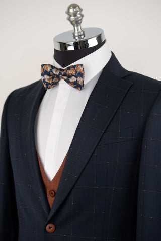 Dark blue Quesste extended suit with plaid pattern and a brown vest