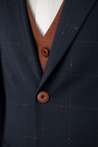 Dark blue Quesste extended suit with plaid pattern and a brown vest