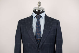 Dark blue Quesste extended suit with plaid pattern and a vest