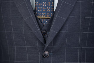 Dark blue Quesste extended suit with plaid pattern and a vest