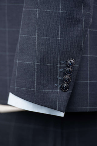 Dark blue Quesste extended suit with plaid pattern and a vest