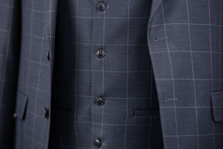 Dark blue Quesste extended suit with plaid pattern and a vest