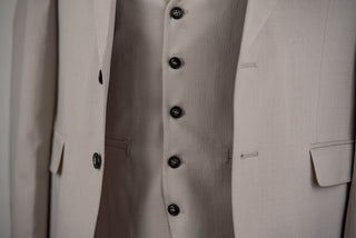 Light beige Quesste extended suit with a vest