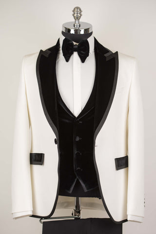 White Quesste slim fit tuxedo with a velvet vest and black lapels