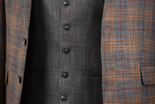 Grey Quesste extended suit with brown, burgundy plaid pattern and a vest