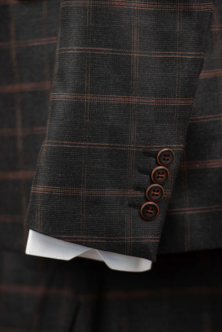 Dark grey Quesste extended suit with brown plaid pattern and a vest