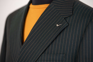 Dark green Lucio double-breasted oversized suit with golden brown stripes