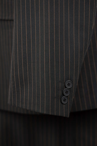 Dark green Lucio double-breasted oversized suit with golden brown stripes
