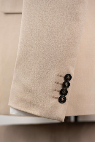 Beige Quesste extended suit with a vest