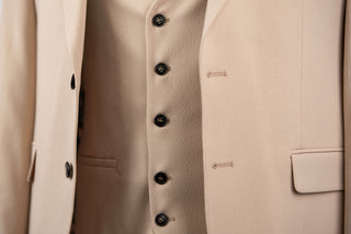 Beige Quesste extended suit with a vest
