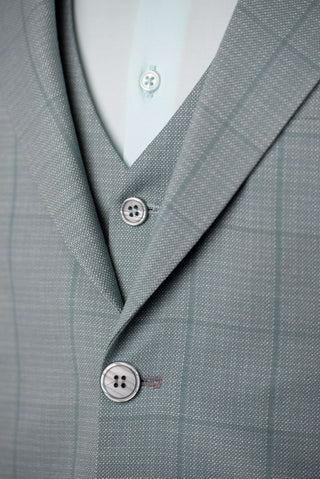 Soft turquoise Azzaro slim fit suit with a vest and a plaid pattern