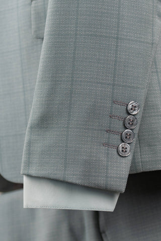 Soft turquoise Azzaro slim fit suit with a vest and a plaid pattern
