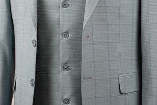 Soft turquoise Azzaro slim fit suit with a vest and a plaid pattern