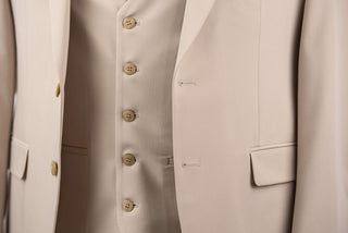 Beige Quesste extended suit with a vest
