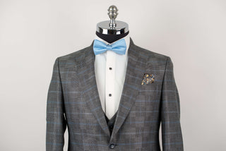 Grey Quesste extended suit with a vest and a light blue plaid pattern