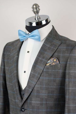 Grey Quesste extended suit with a vest and a light blue plaid pattern