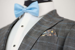 Grey Quesste extended suit with a vest and a light blue plaid pattern