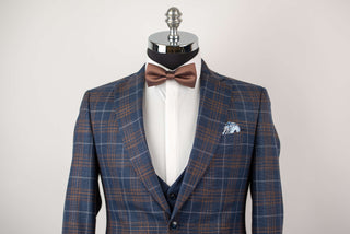 Blue Quesste extended suit with a vest and brown, grey plaid pattern