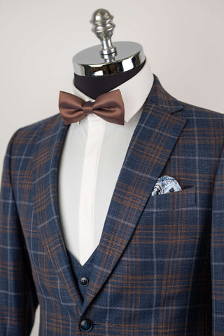 Blue Quesste extended suit with a vest and brown, grey plaid pattern