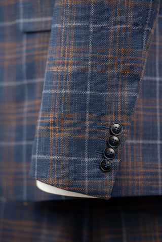 Blue Quesste extended suit with a vest and brown, grey plaid pattern