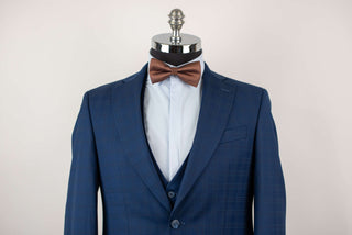 Blue Quesste extended suit with a vest and a soft plaid pattern