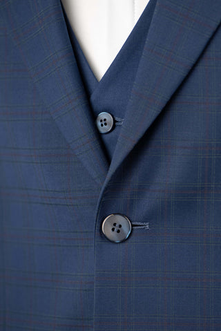 Blue Quesste extended suit with a vest and a soft plaid pattern