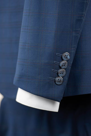 Blue Quesste extended suit with a vest and a soft plaid pattern