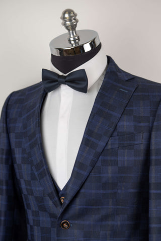 Dark blue Quesste extended suit with a vest and a plaid pattern