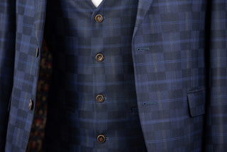 Dark blue Quesste extended suit with a vest and a plaid pattern