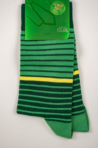 Zaļas zeķes ar tumši zaļām un dzeltenām svītrām