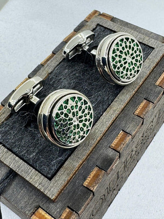 Silver cufflinks with green decorative inlays